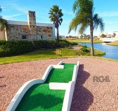 MAGNÍFICA MANSÃO A BEIRA LAGO NO COND. ENSEADA - 6 SUÍTES, 8 BANHEIROS E 2 VAGAS