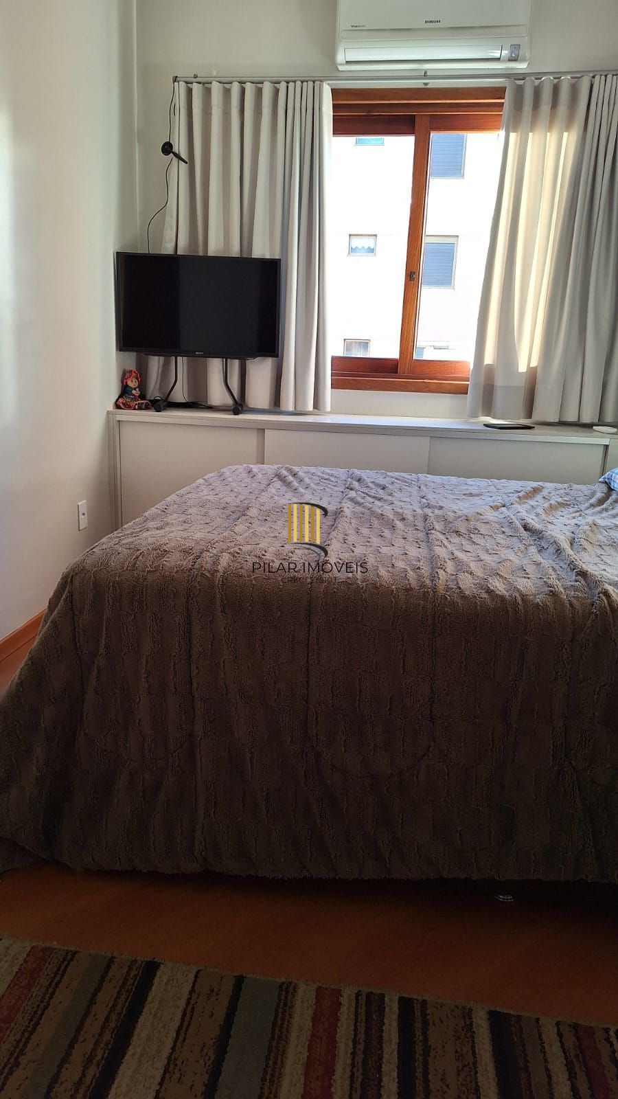 Apartamento de 2 domitórios, com varanda, churrasqueira, 2 vagas.
