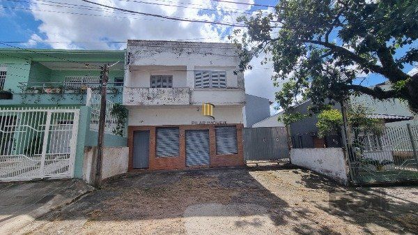 Casa /Sobrado  com apartamento e loja, estacionamento, a venda no Bairro Jardim Itu.  Lojão embaixo com dois banheiros e divisórias, - Pilar Imóveis