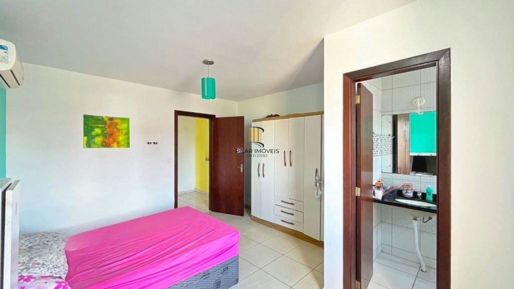 Casa de 2 dormitórios à venda Rua Heitor Kramer, Guarujá - Porto Alegre