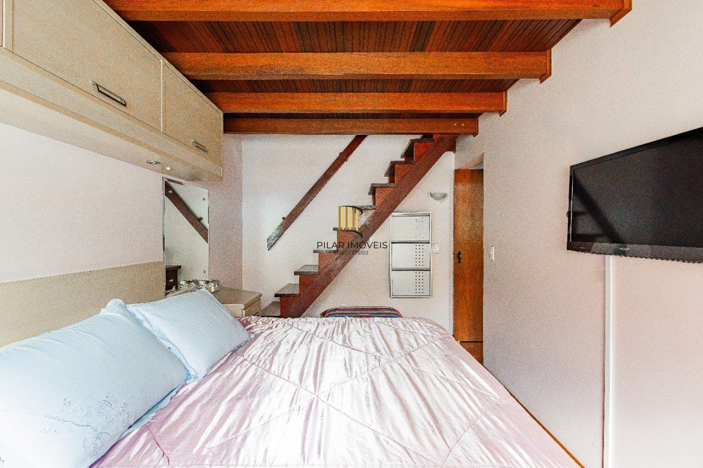 Casa de 4 dormitórios e 208m² à venda no Bairro Jardim Botânico, Porto Alegre.