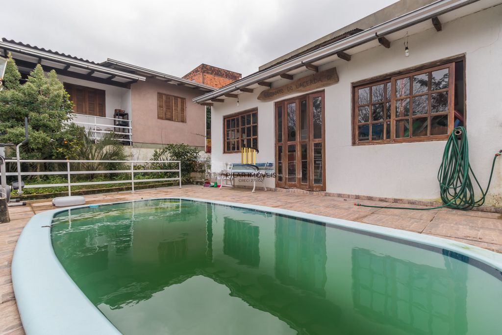 Casa de 6 dormitórios à venda Bairro Vila Nova - Porto Alegre
