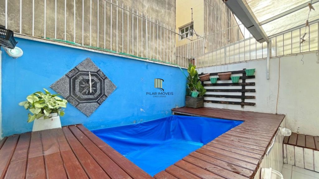 Casa de 2 dormitórios à venda Rua Heitor Kramer, Guarujá - Porto Alegre