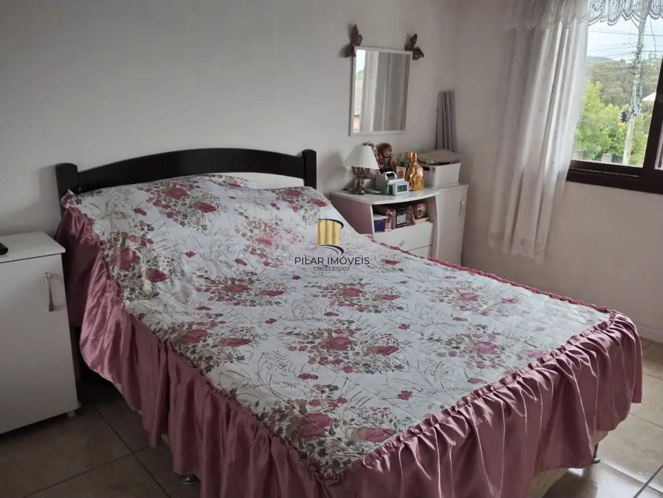 Casa de 3 dormitórios e 111m² à venda em Jardim Botânico, Porto Alegre.