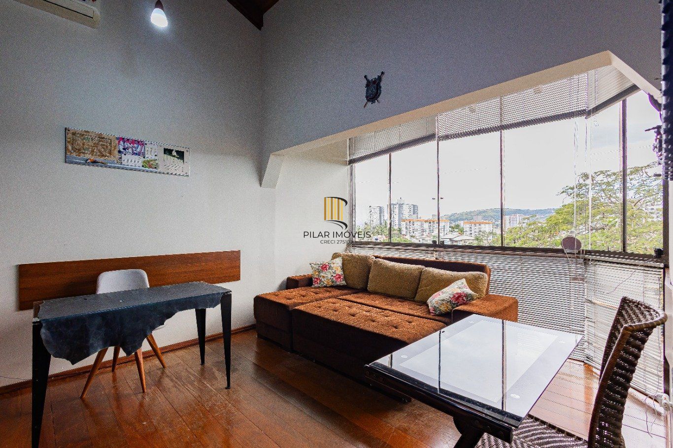 Casa de 4 dormitórios e 208m² à venda no Bairro Jardim Botânico, Porto Alegre.
