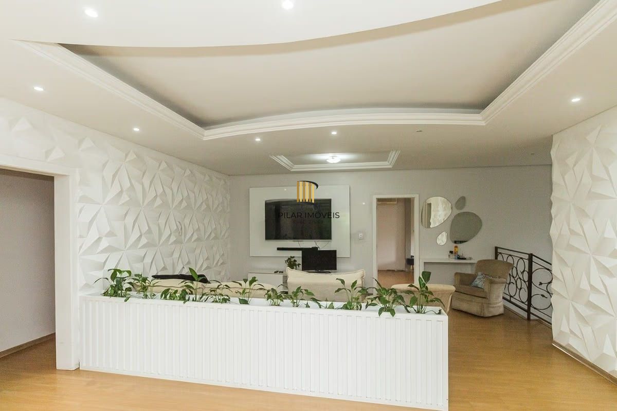 Casa com 5 dormitórios à venda em Parque Santa Fé, Porto Alegre.