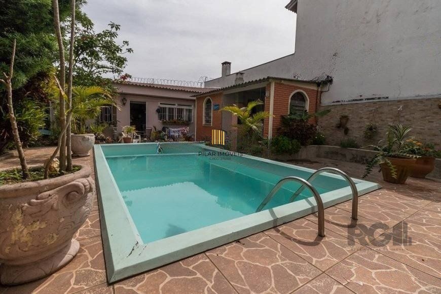 CASA PRÓXIMA AO PONTAL, com 5 vagas, 3 dormitórios!