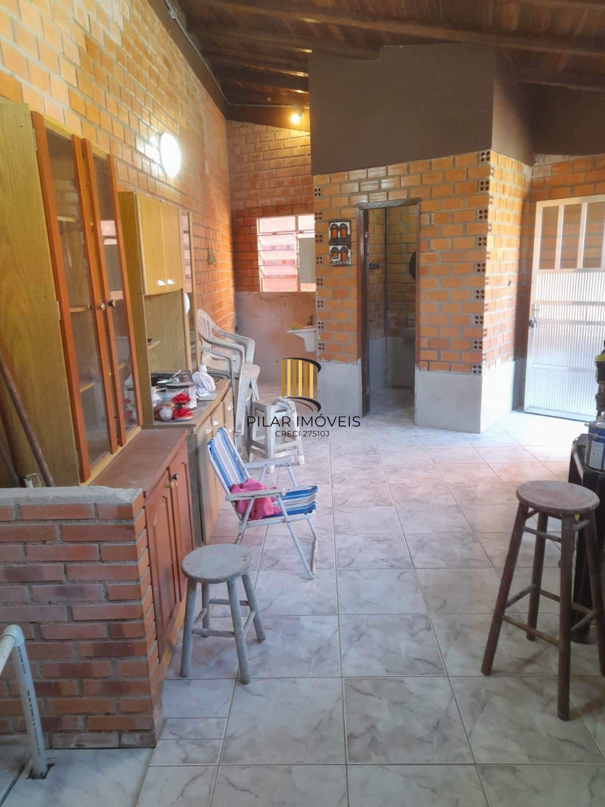 Casa à venda com piscina no bairro Glória, Zona Sul de Porto Alegre – 207m² construídos, pátio amplo e excelente potencial residencial