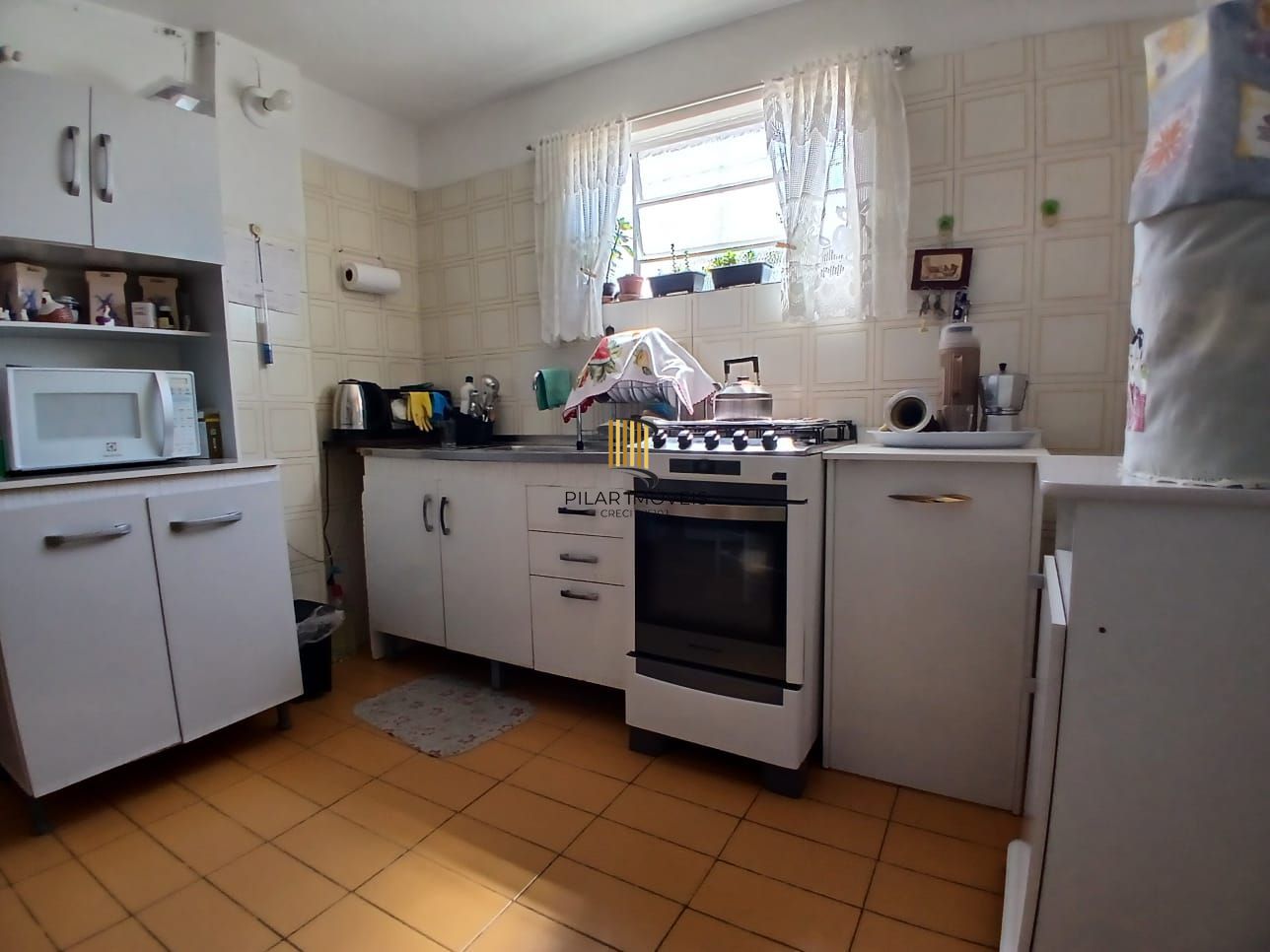 Casa com 03 dormitorios e amplo jardim no bairro Santa Tereza /RS