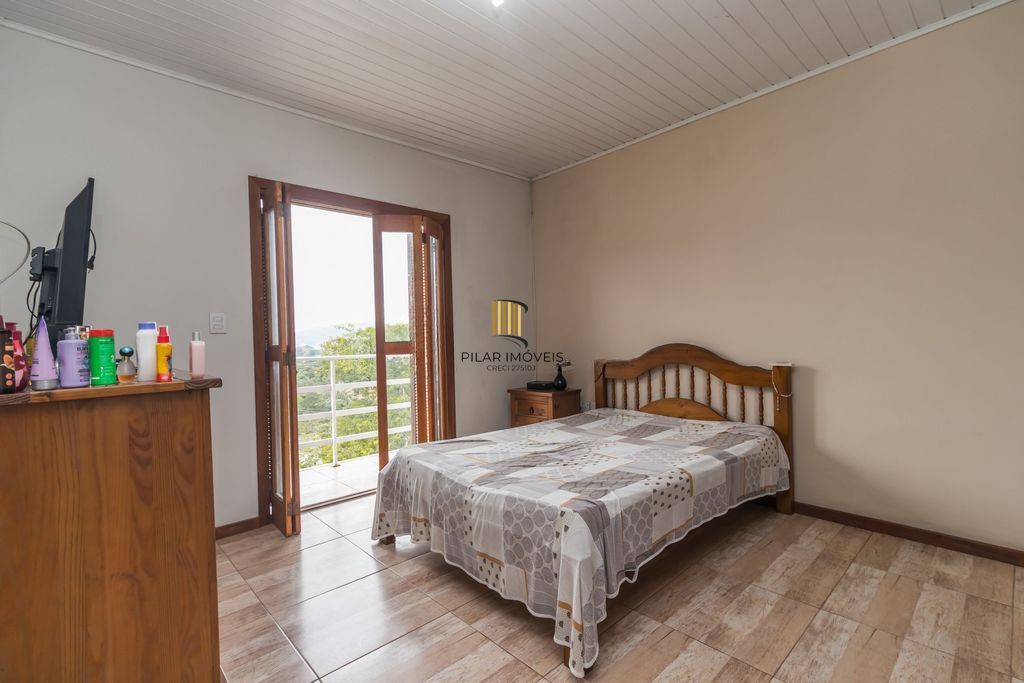 Casa de 6 dormitórios à venda Bairro Vila Nova - Porto Alegre