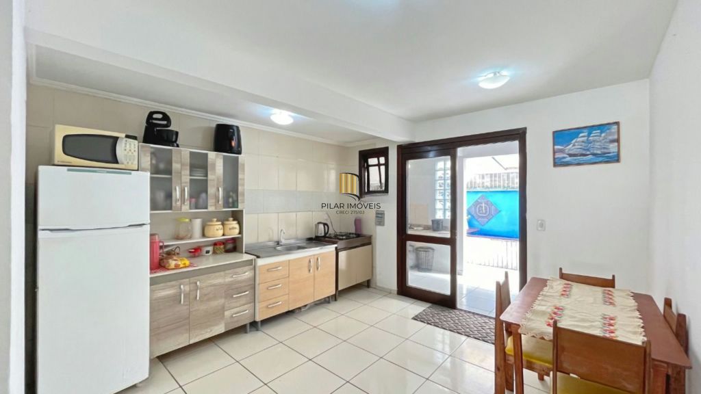 Casa de 2 dormitórios à venda Rua Heitor Kramer, Guarujá - Porto Alegre