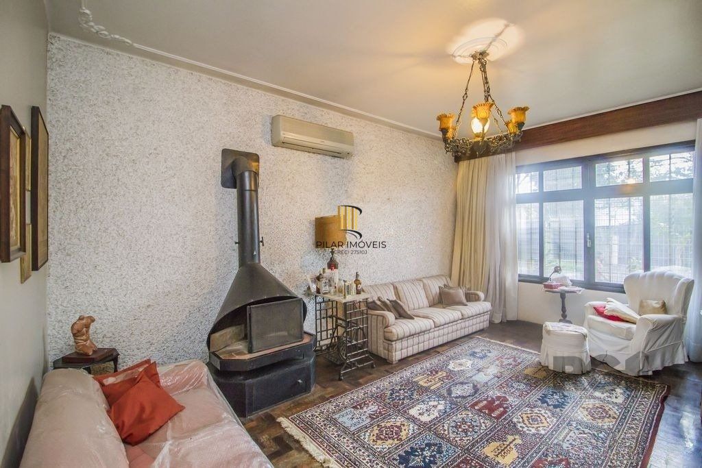 Casa de 4 dormitórios, bairro Santa Tereza