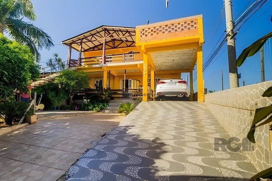 casa de 4 dormitórios,  no bairro Lomba do Pinheiro - Pilar Imóveis