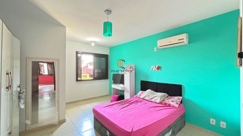 Casa de 2 dormitórios à venda Rua Heitor Kramer, Guarujá - Porto Alegre