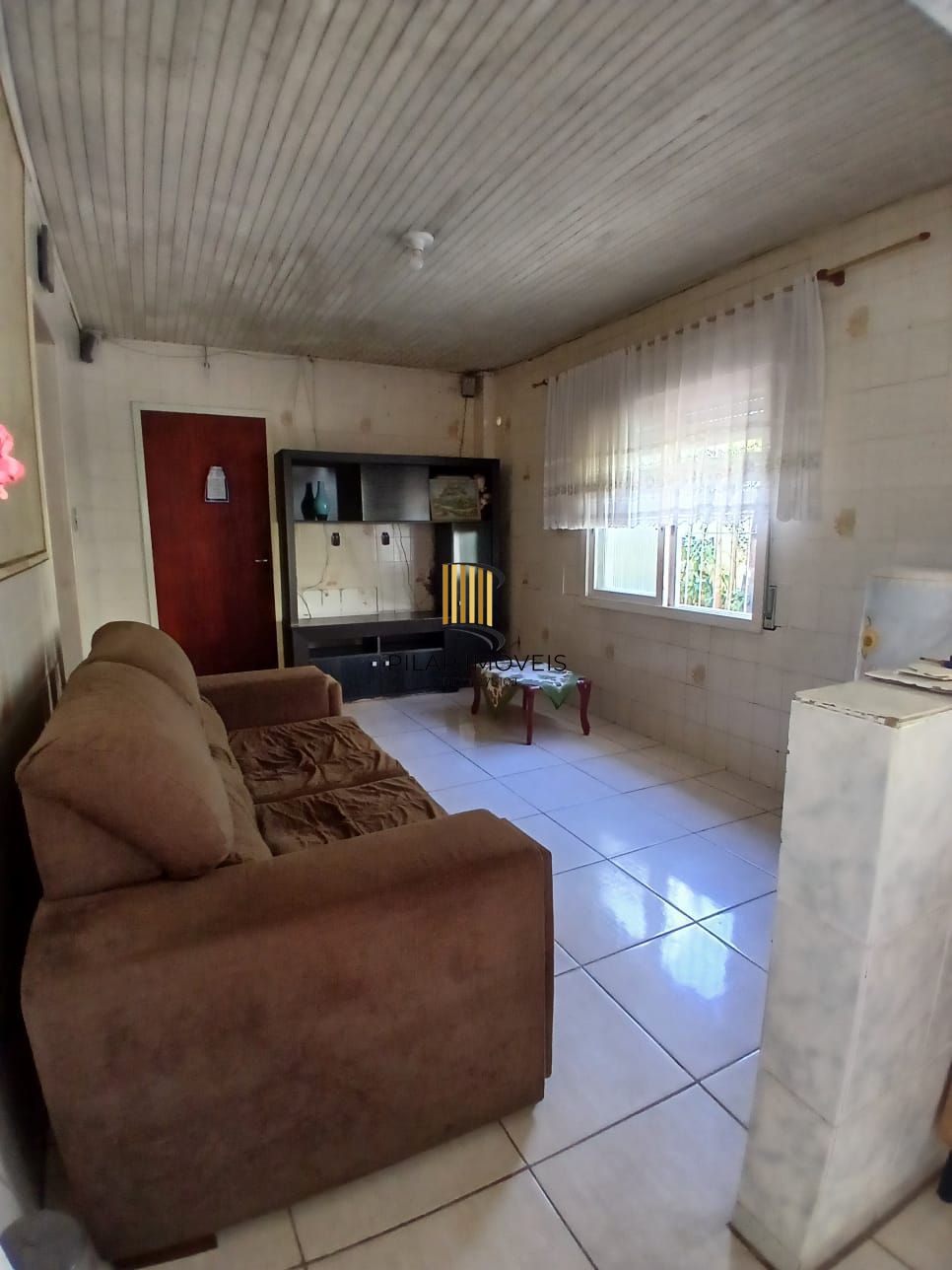 Ampla casa com patio no bairro Rubem Berta .