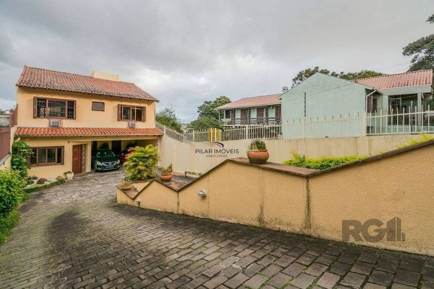 Casa 279m² - 4 dormitórios, 3 vagas no bairro Santa Tereza