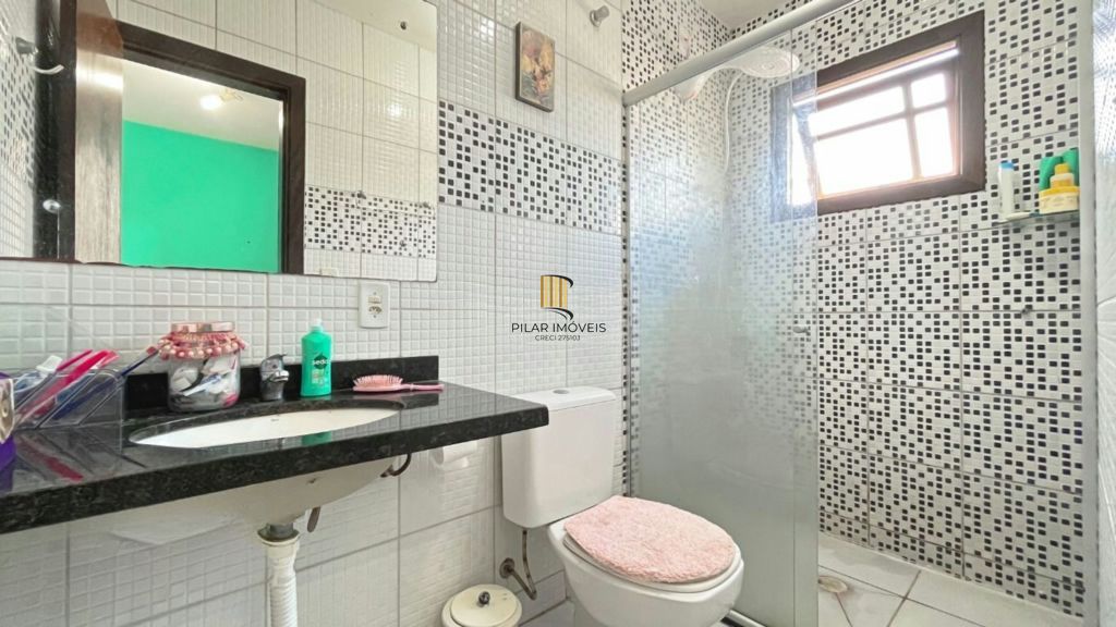 Casa de 2 dormitórios à venda Rua Heitor Kramer, Guarujá - Porto Alegre