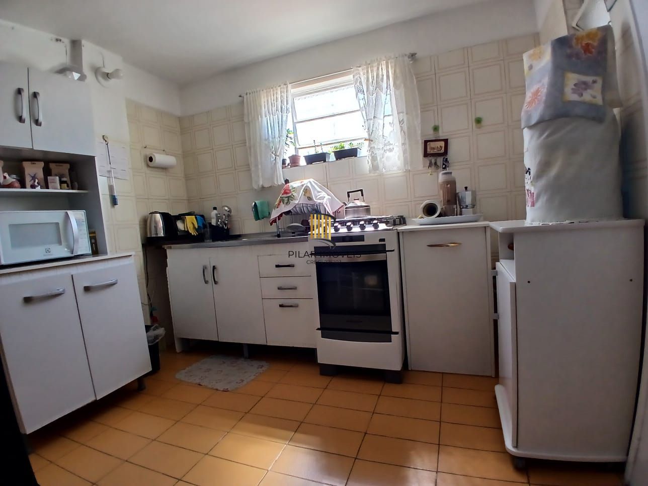 Casa com 03 dormitorios e amplo jardim no bairro Santa Tereza /RS