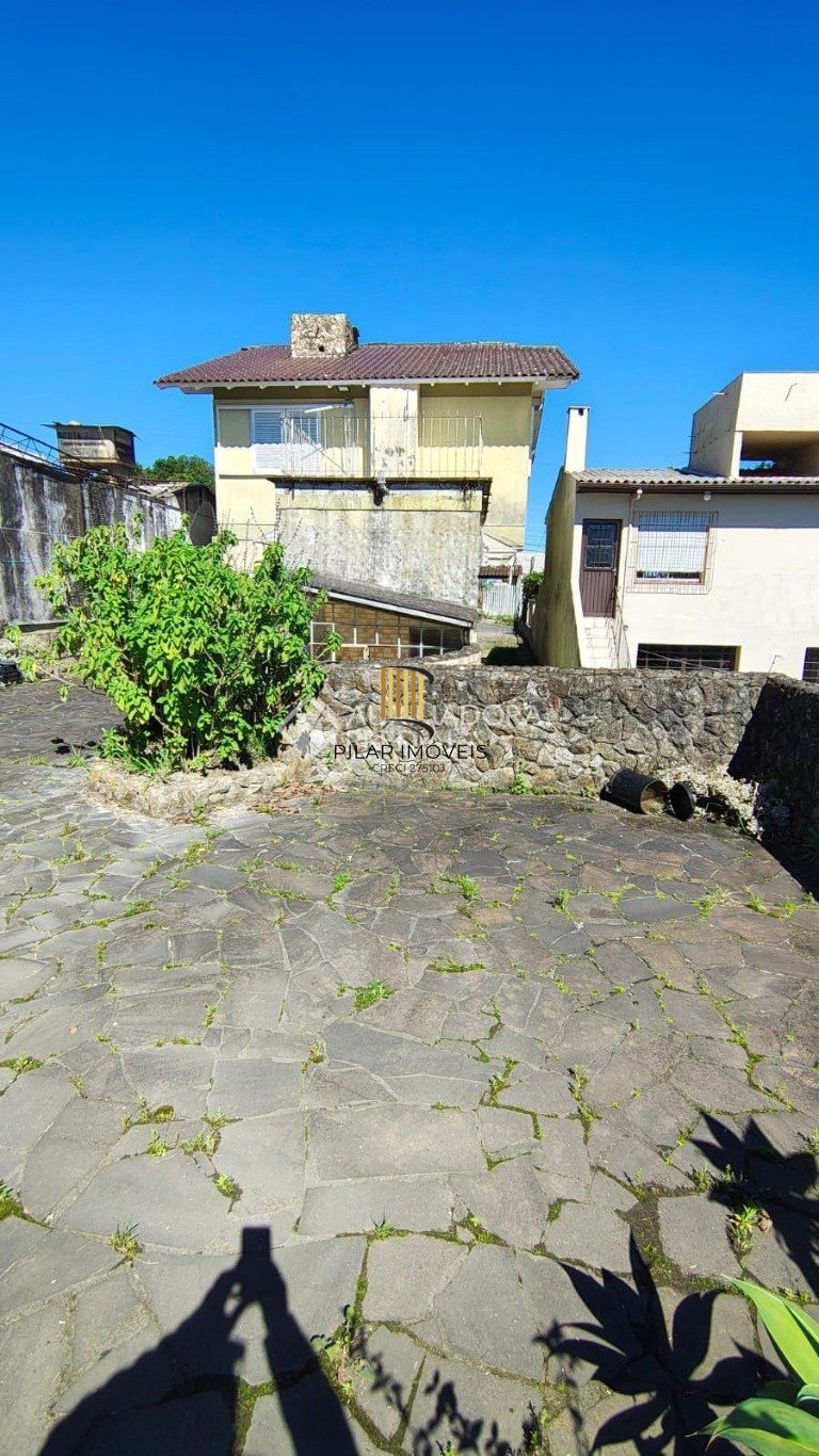 Casa de 3 dormitórios no bairro à venda em Vila Nova, Porto Alegre