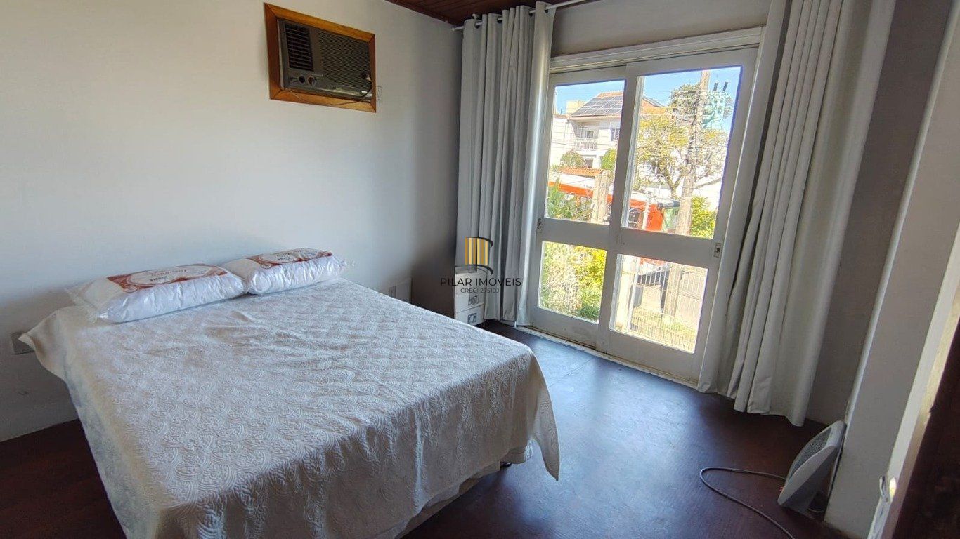 Casa de 3 dormitórios no bairro à venda em Vila Nova, Porto Alegre