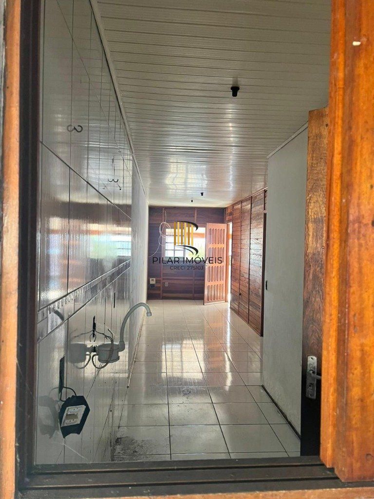 Terreno de 392m² com casa mista de 82m²