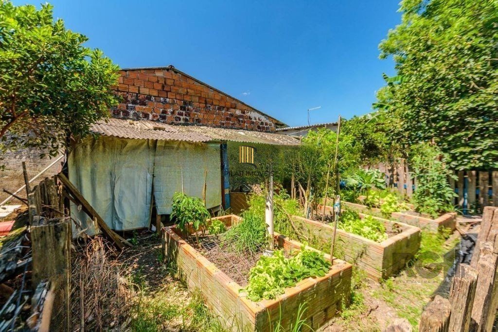 Casa de 3 dormitórios no bairro Rubem Berta