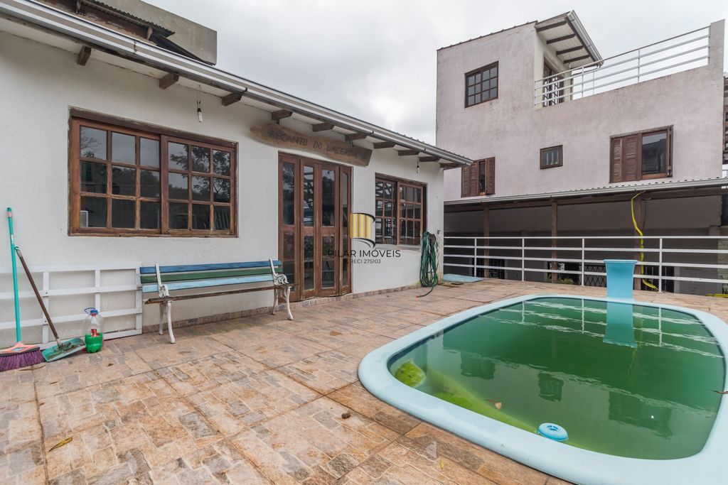 Casa de 6 dormitórios à venda Bairro Vila Nova - Porto Alegre