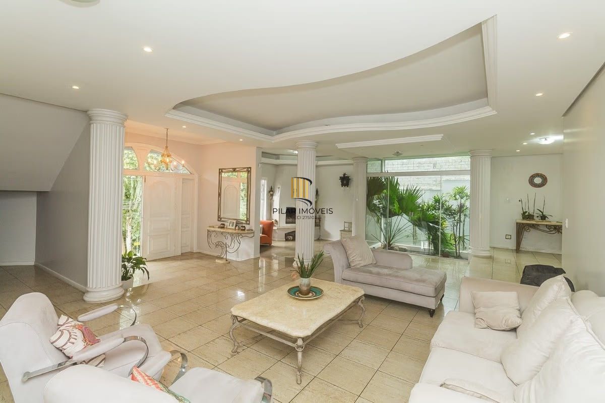 Casa com 5 dormitórios à venda em Parque Santa Fé, Porto Alegre.