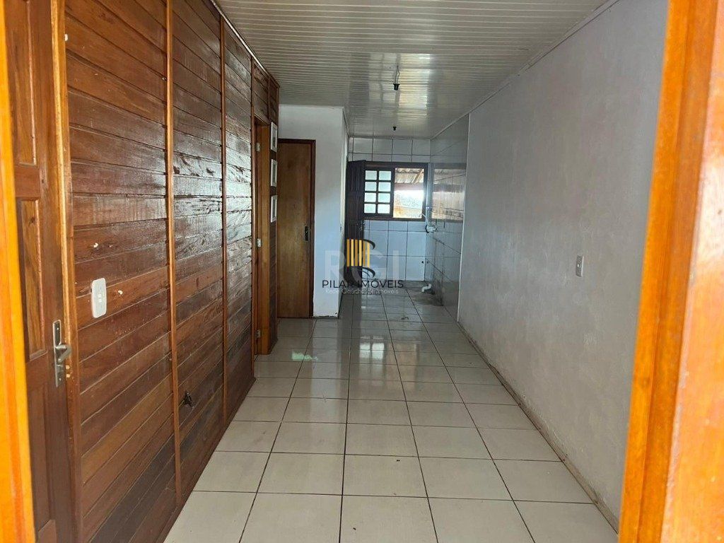 Terreno de 392m² com casa mista de 82m²