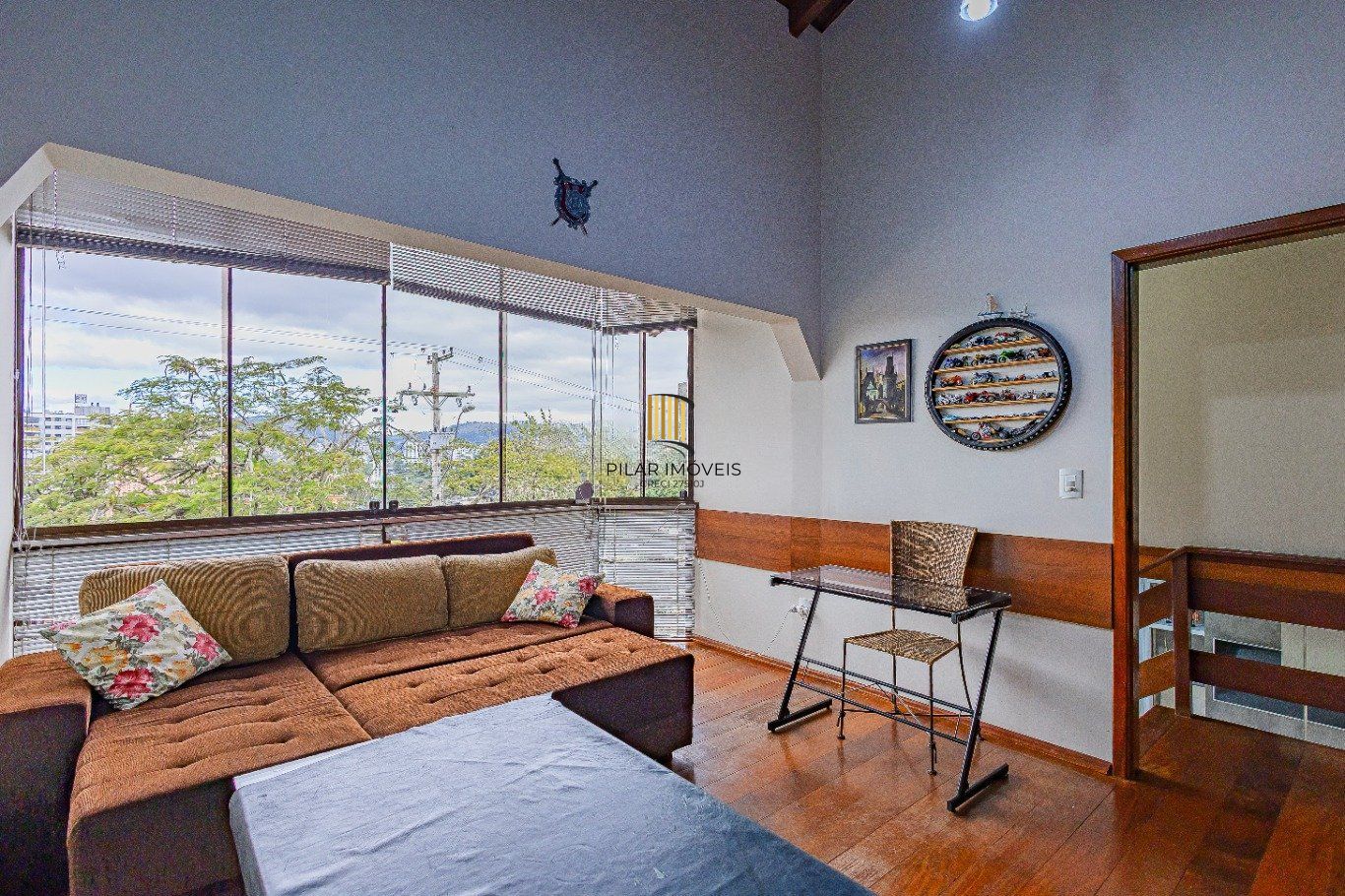 Casa de 4 dormitórios e 208m² à venda no Bairro Jardim Botânico, Porto Alegre.