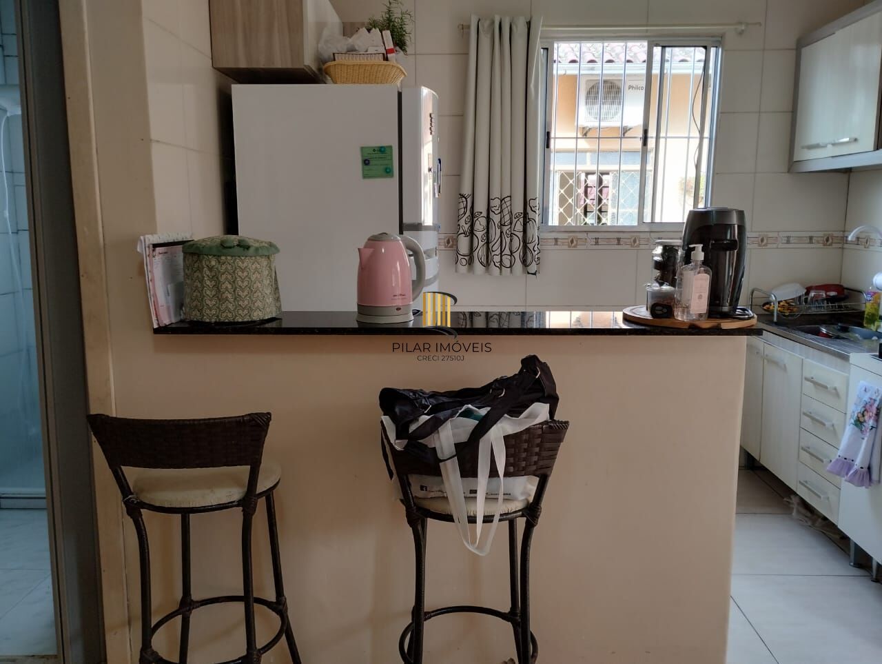 Terreno com duas frentes, três casas  (duas c/dois dormitórios e a outra tipo tipo JK)