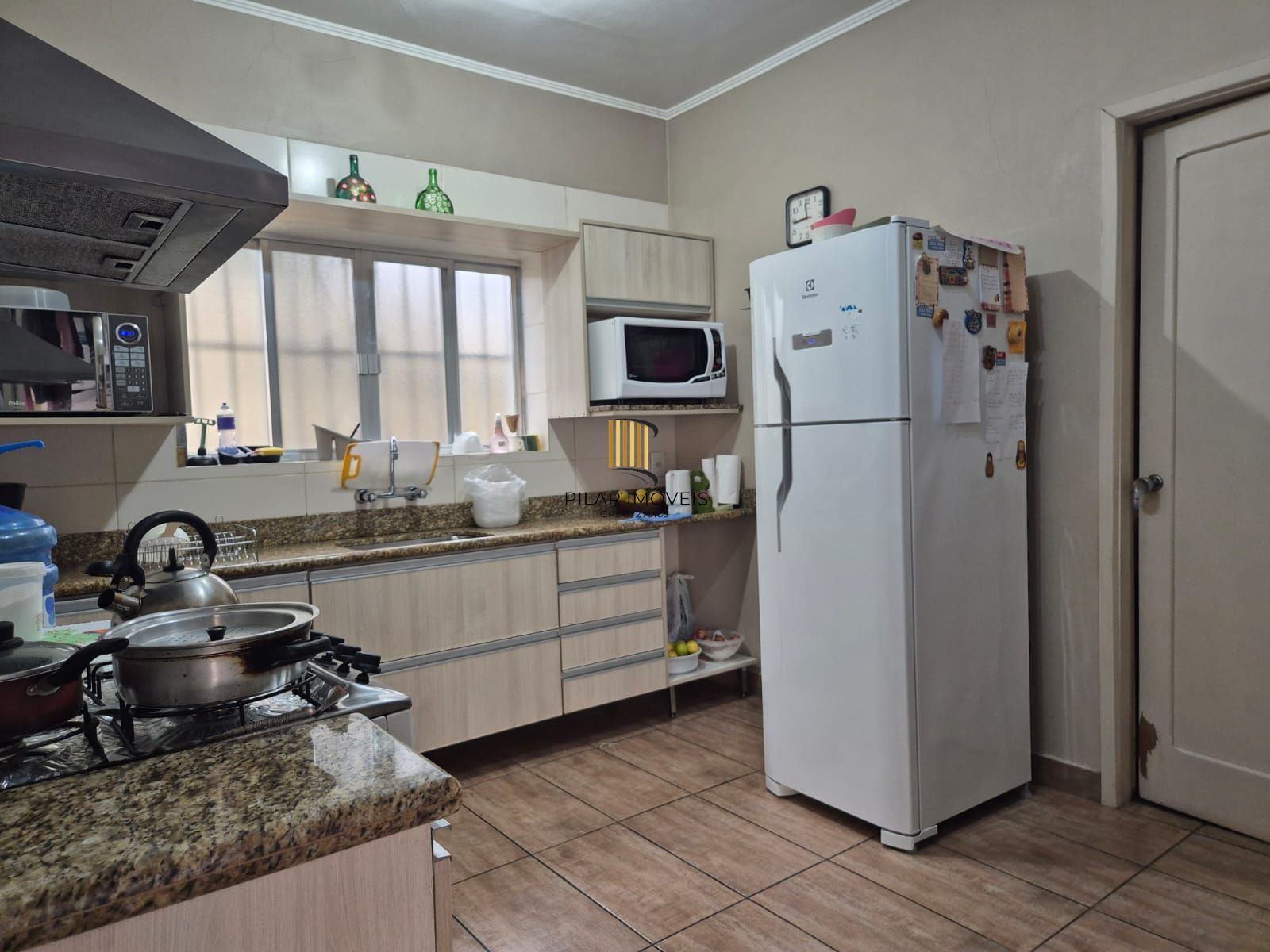 Terreno com 2 casas, totalizando 434,72m2. Excelente lotalização no coração do Menino Deus