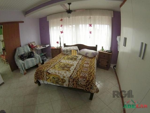Casa 4 dormitórios no bairro Itapuã