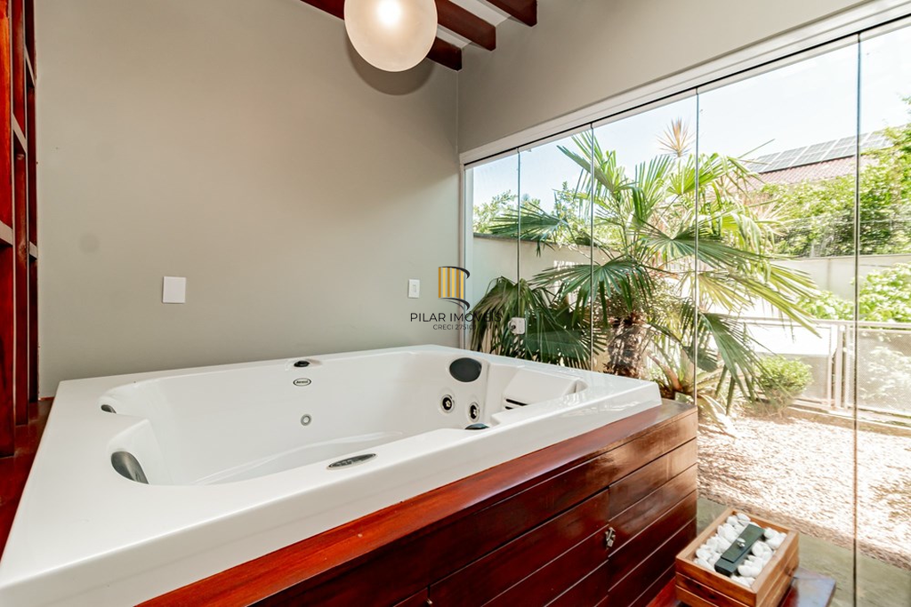 Casa de Condomínio 4 dormitórios no bairro Passo das Pedras