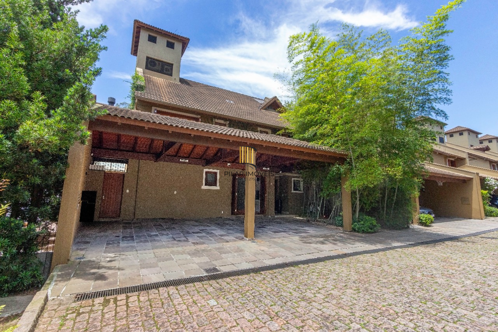 Casa de Condomínio 4 dormitórios no bairro Três Figueiras