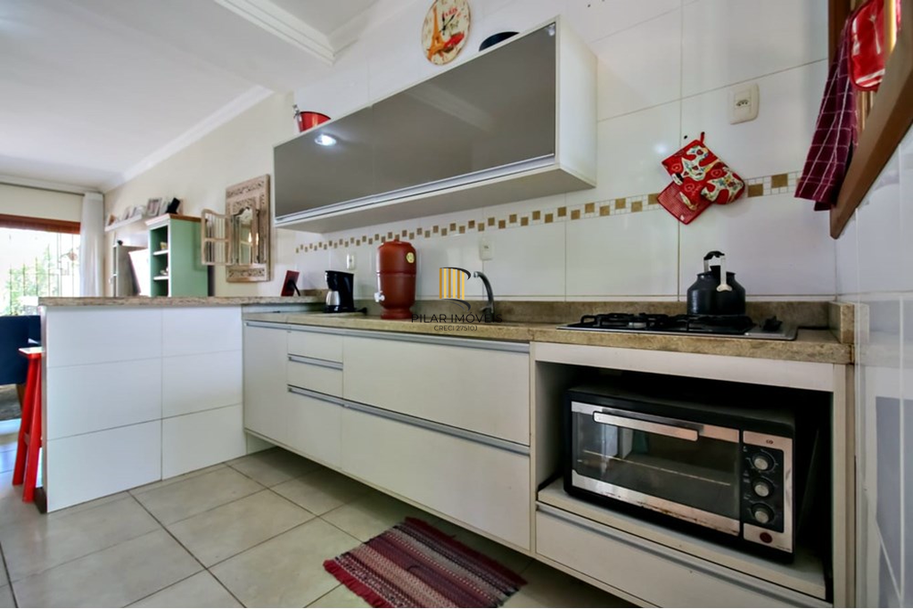 Casa 3 dormitórios no bairro Guarujá