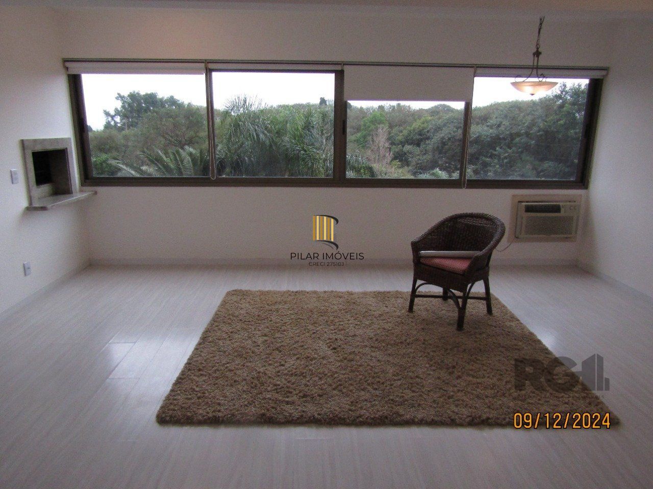 Apartamento de três dormitórios, suíte e duas vagas de garagem no bairro Higienópolis em Porto Alegre.