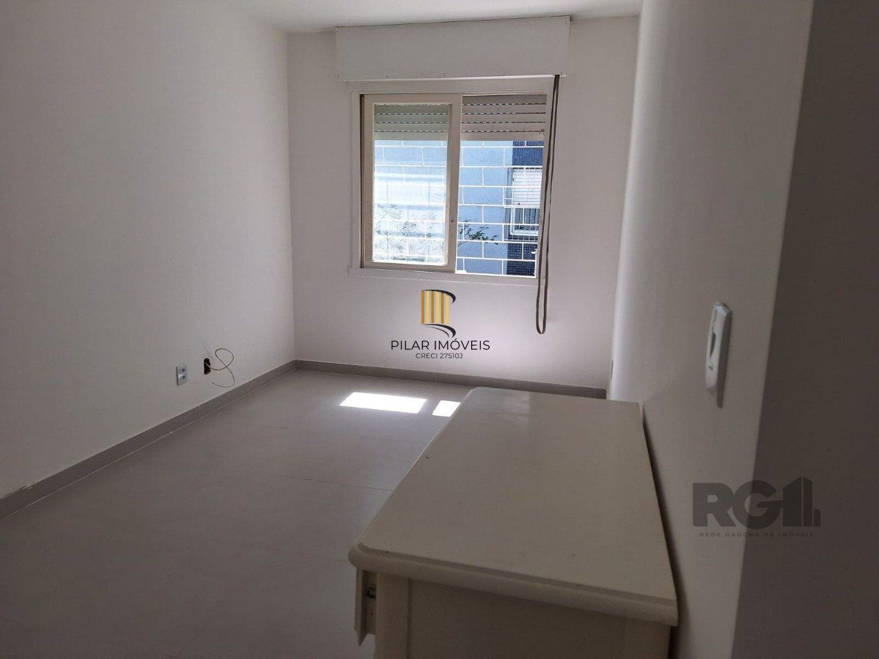 Apartamento térreo de um dormitório transformado em dois dormitórios