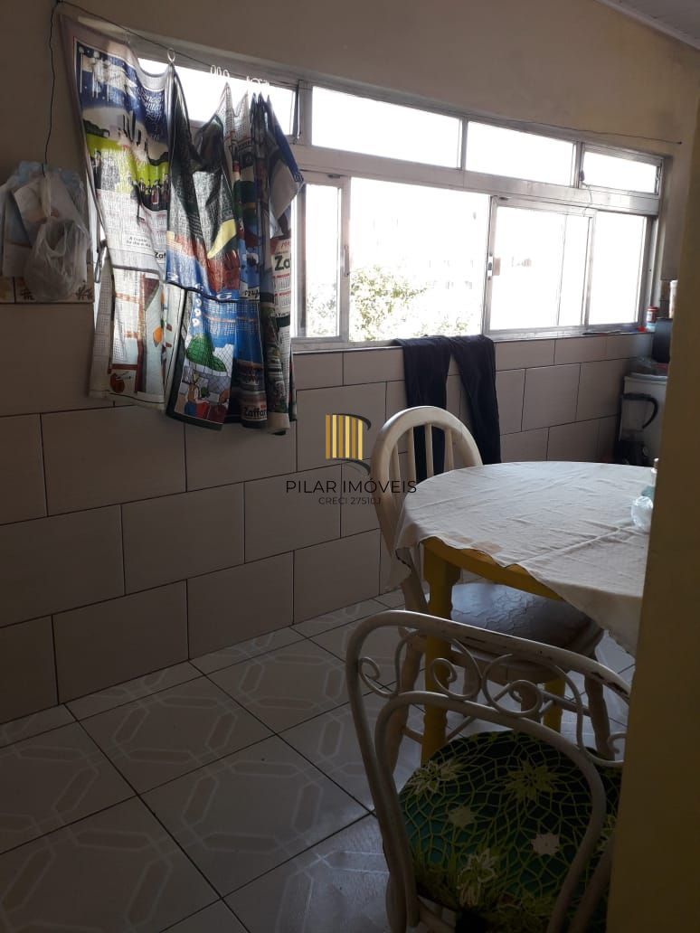 Terreno com 2 casas de Alvenaria