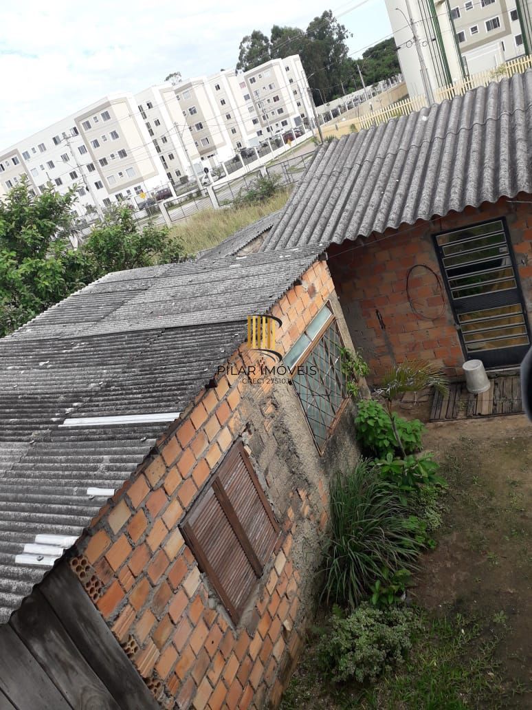 Terreno com 2 casas de Alvenaria