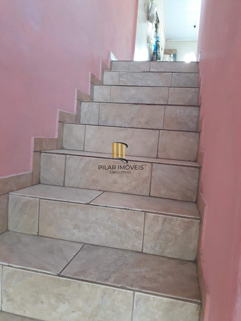 Terreno com 2 casas de Alvenaria