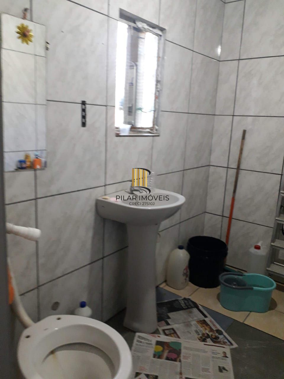 Terreno com 2 casas de Alvenaria