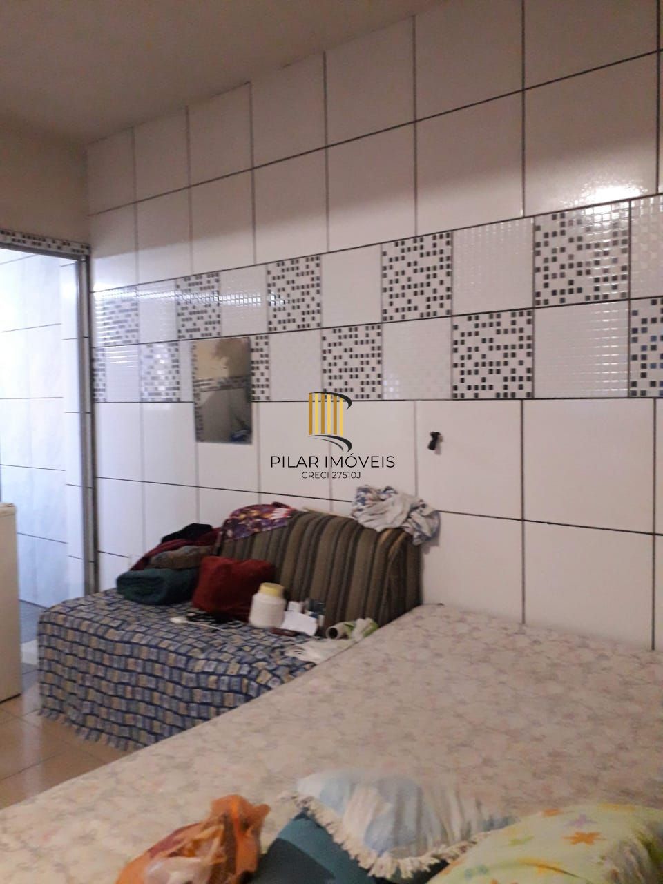 Terreno com 2 casas de Alvenaria