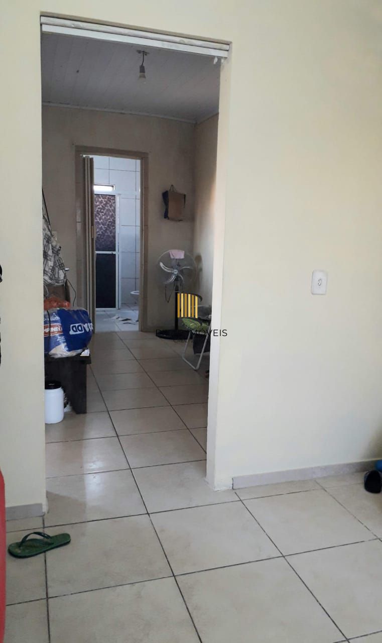 Terreno com 2 casas de Alvenaria