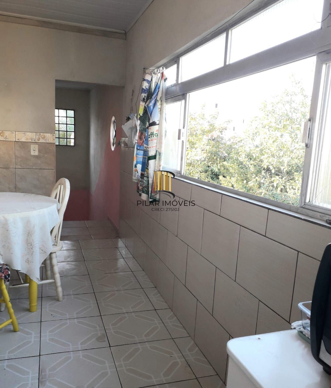 Terreno com 2 casas de Alvenaria