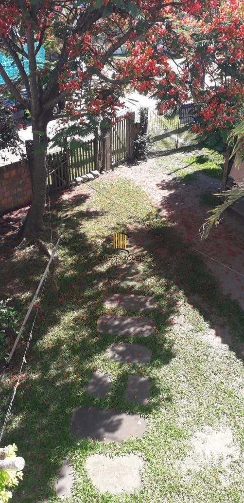 Terreno com 2 casas de Alvenaria