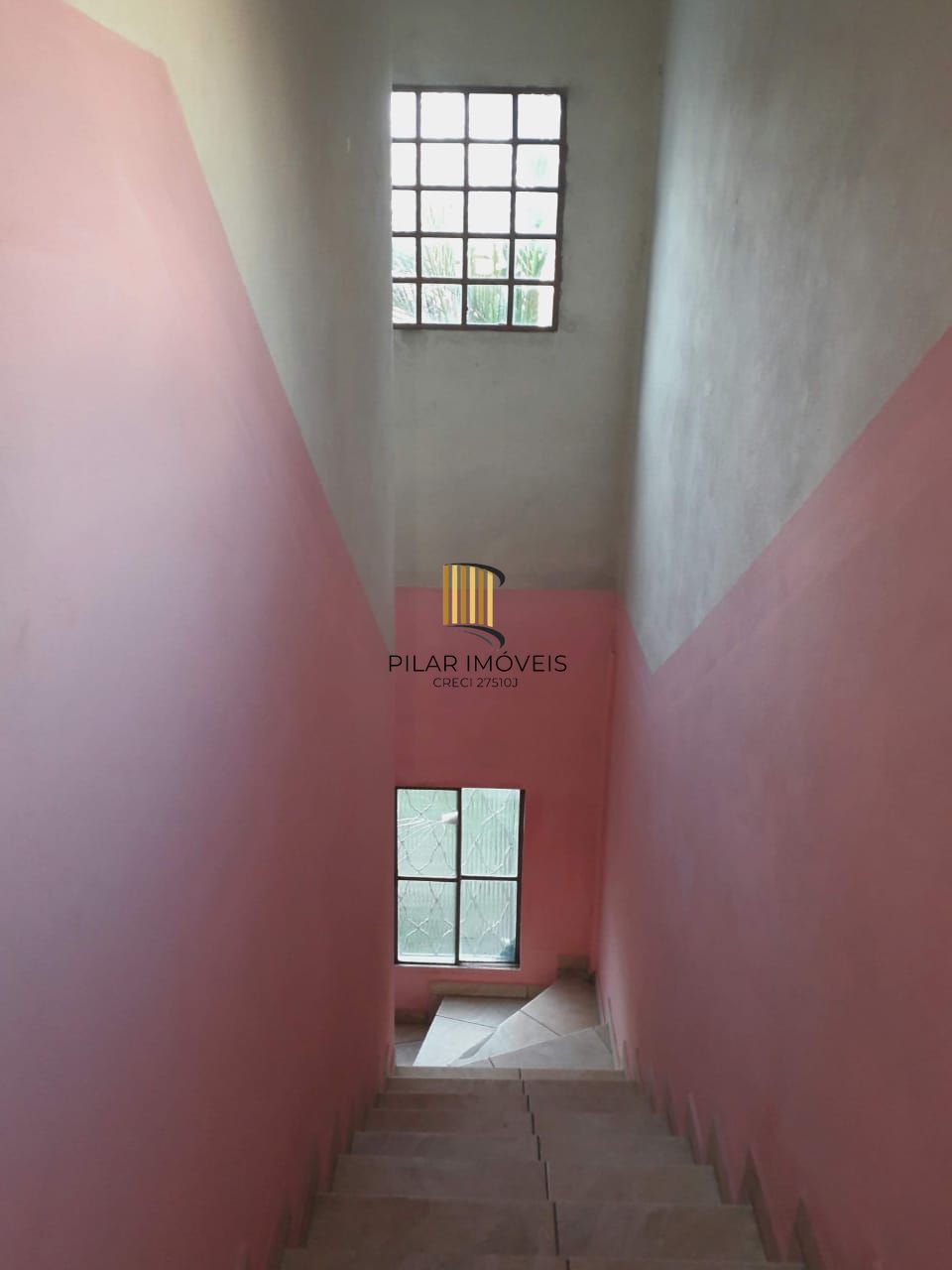 Terreno com 2 casas de Alvenaria