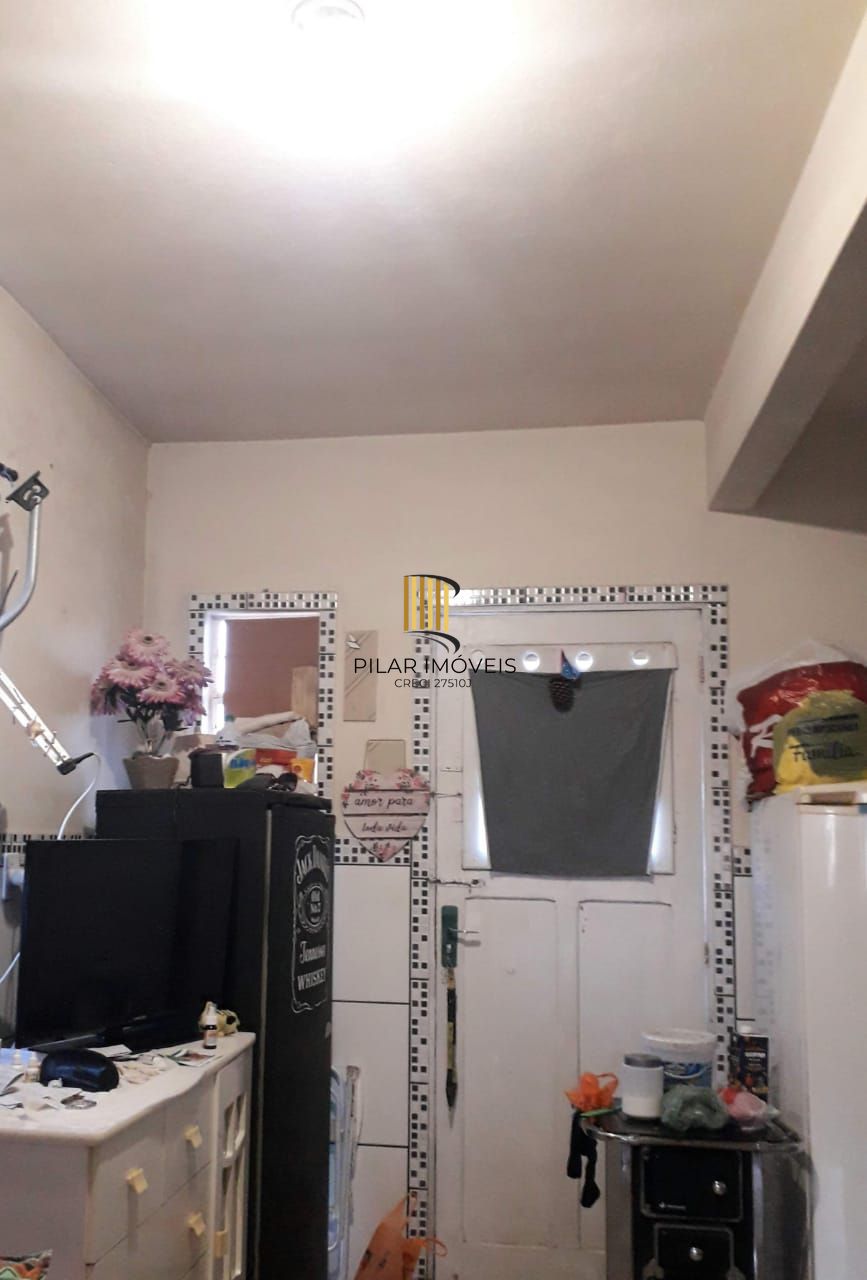 Terreno com 2 casas de Alvenaria