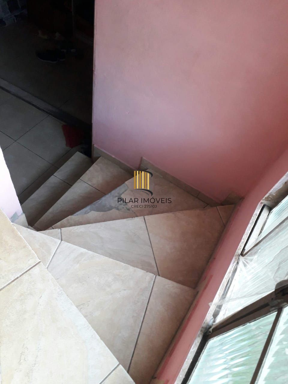 Terreno com 2 casas de Alvenaria