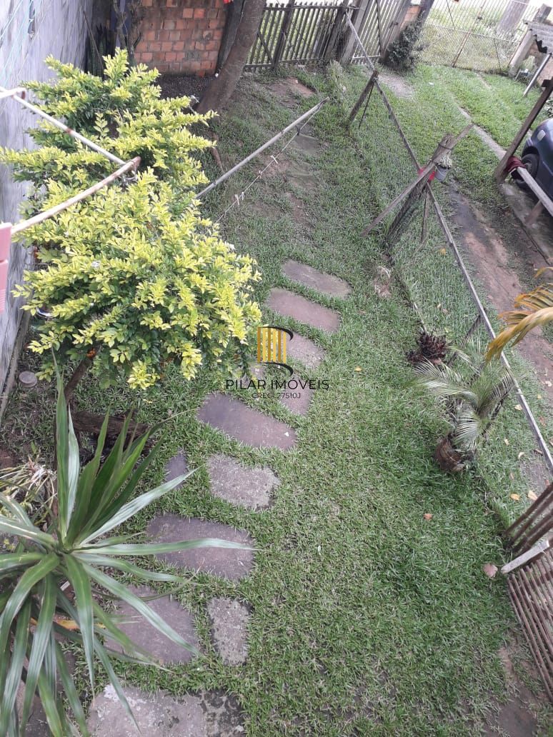 Terreno com 2 casas de Alvenaria